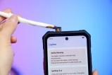 Oukitel phone with built-in lighter functionality.