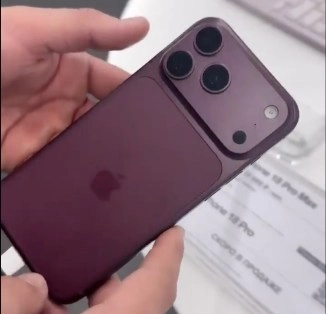iPhone 18 Pro Max Dark Cherry held, leak.