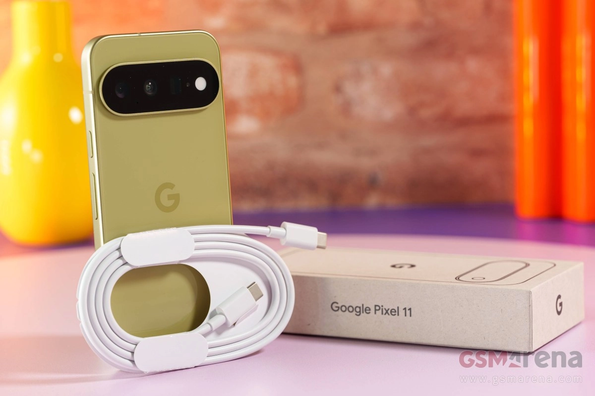 Google Pixel 11 phone, charging cable, and box.