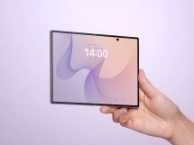 Foldable Galaxy Z Fold8 held open, displaying clock.