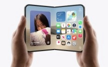 Foldable iPhone Duo device held open.