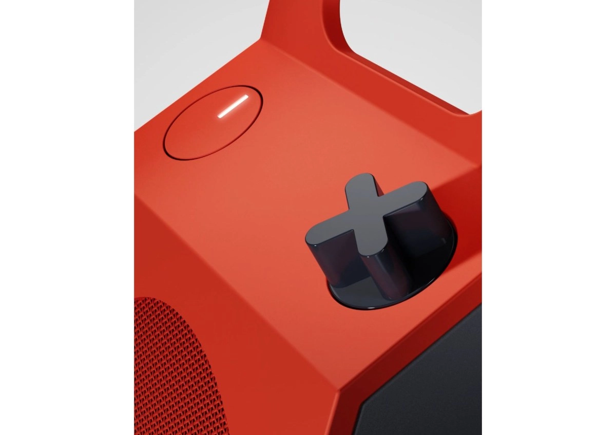 Red CMF device with black directional button.