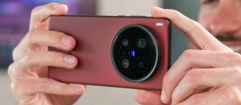 Red smartphone with quad-lens camera system.
