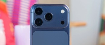 Blue iPhone camera array with three lenses.