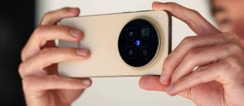 Smartphone held horizontally, showing circular camera array.