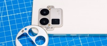 Smartphone camera module on blue grid background.