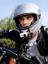 Dreame Leaptic Cube action camera on motorcycle helmet.