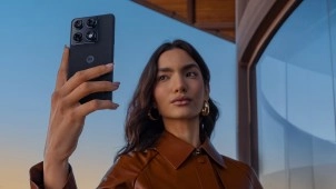 Woman taking selfie with Motorola Signature phone.