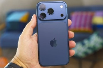 Blue iPhone 15 Pro concept phone back held