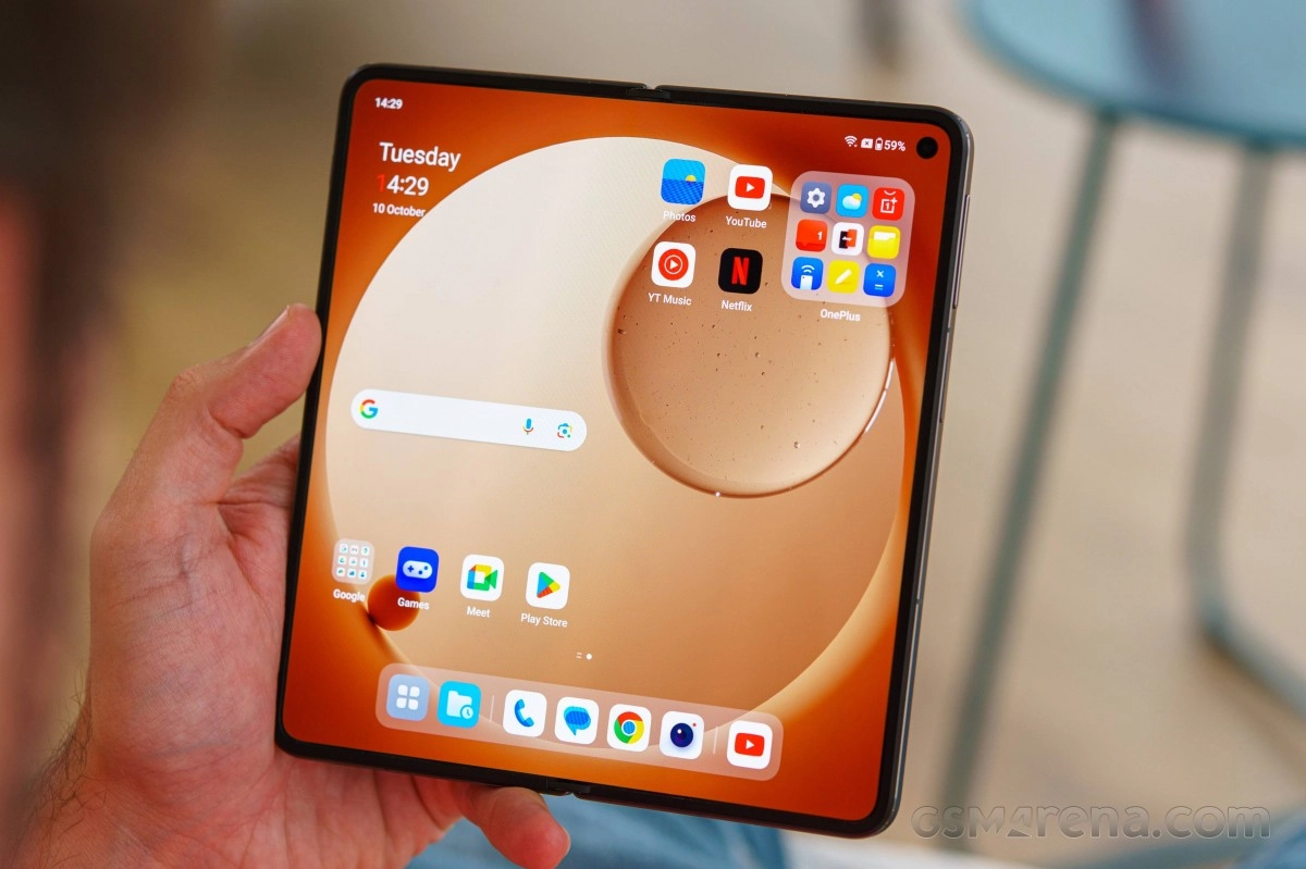 OnePlus Open folded smartphone showing app icons.