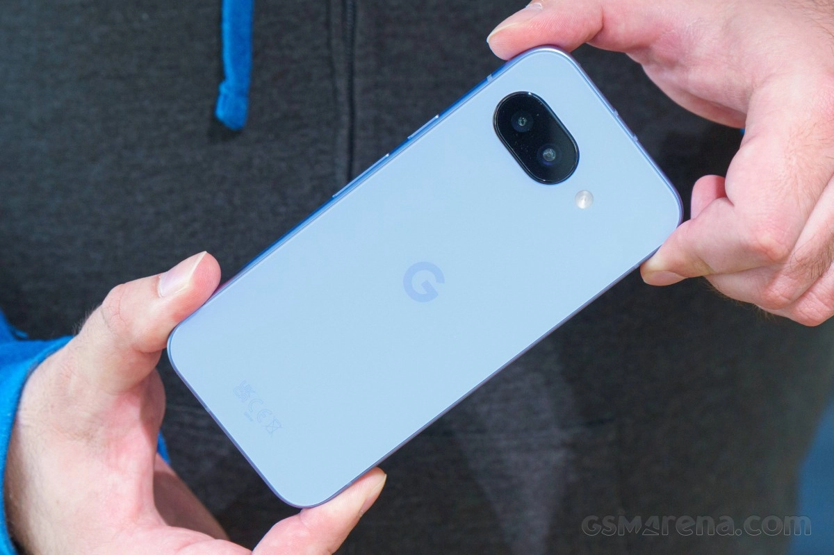 Blue Google Pixel 7a hands holding phone back.