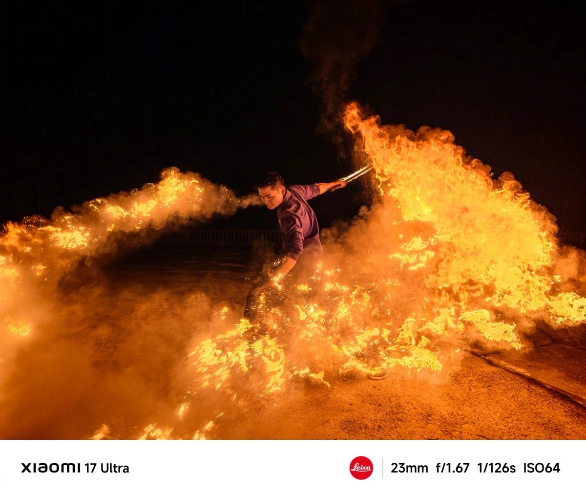 Man breathing fire with Xiaomi 17 Ultra camera.