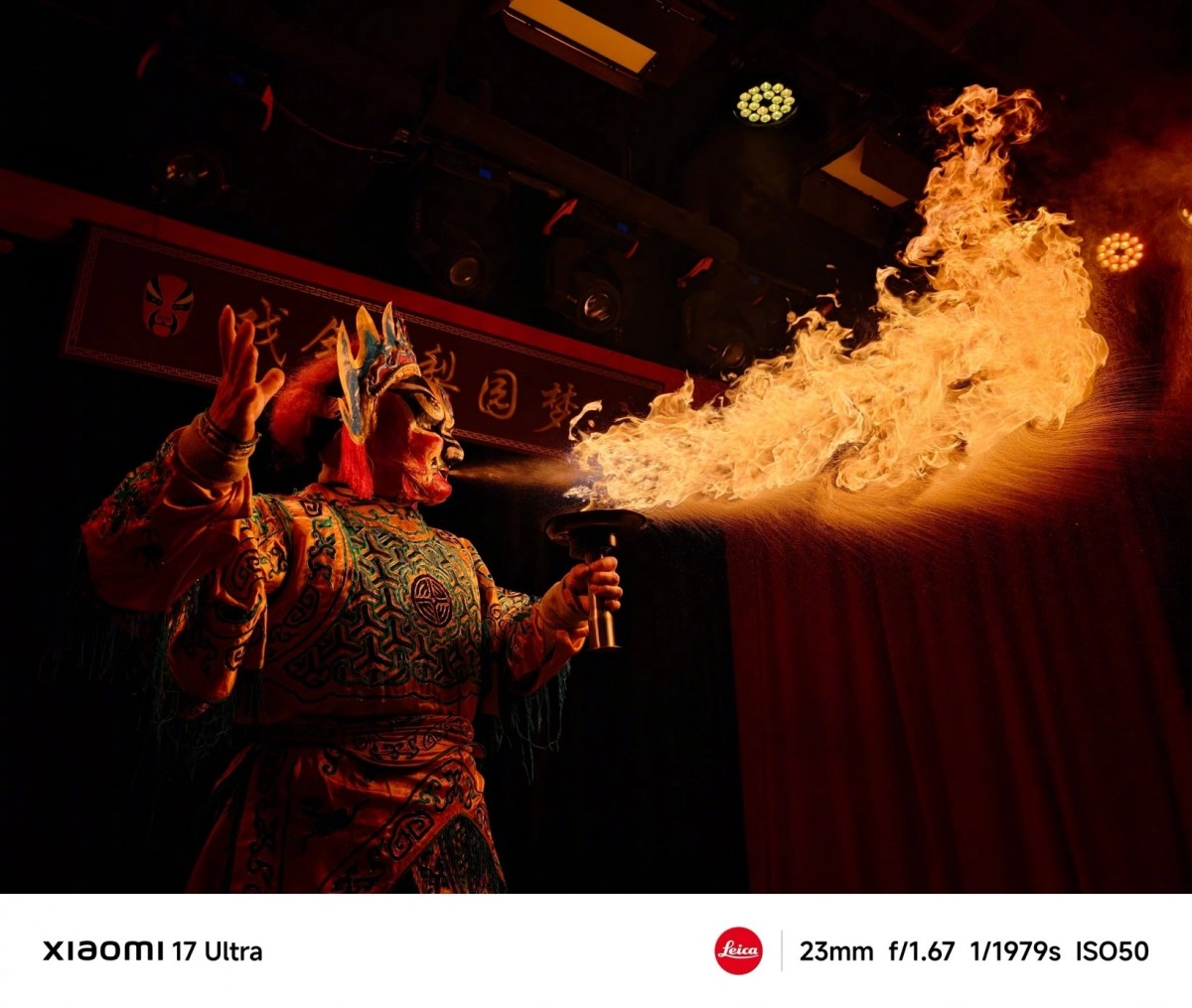 Performer breathes fire from torch, captured by Xiaomi 17 Ultra.