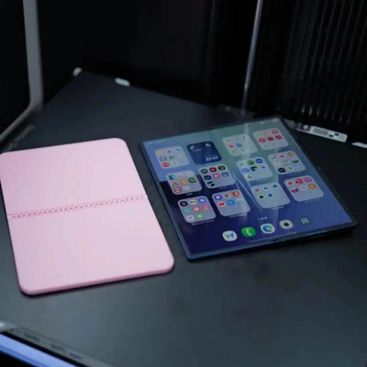 Mockup iPhone Fold next to Galaxy Z Fold7 mockup.