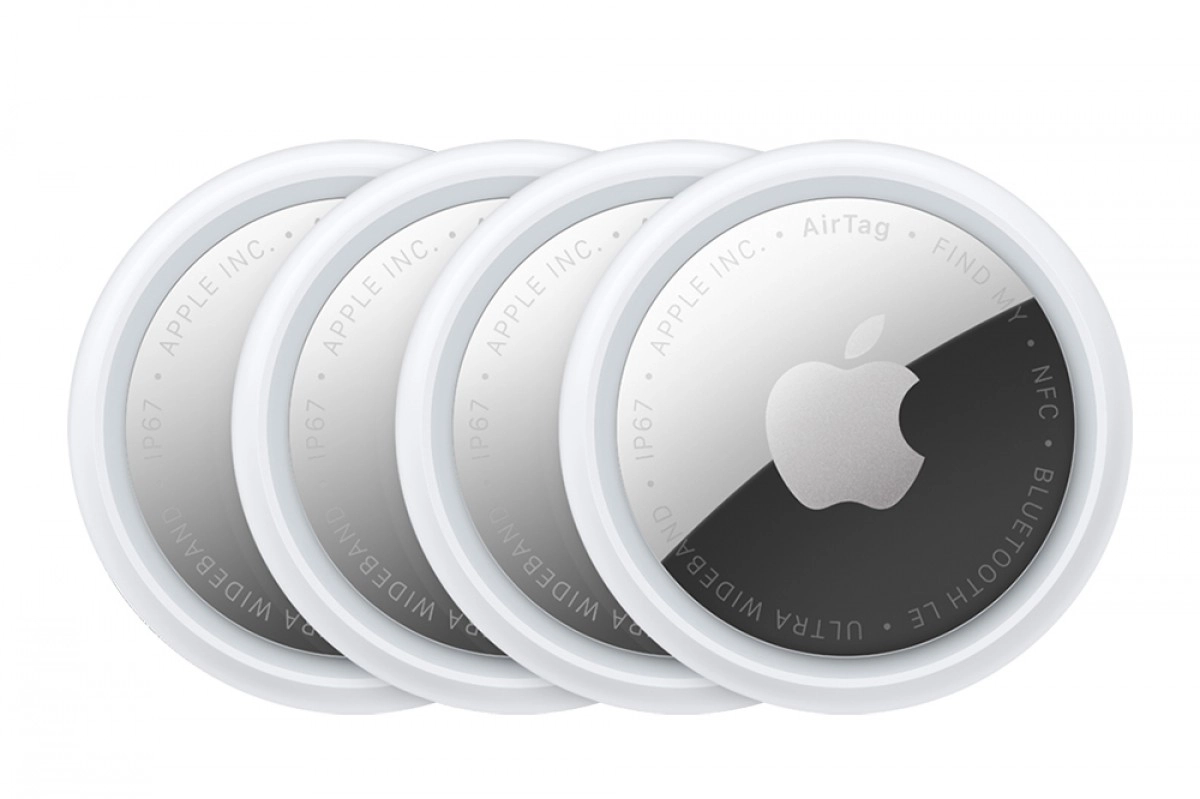 Four Apple AirTag item trackers.