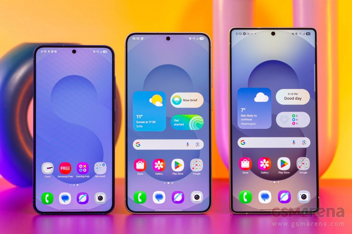 Three Samsung phones display One UI 6.1 interface.