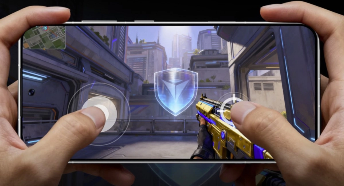 Hands holding phone playing futuristic shooter game.