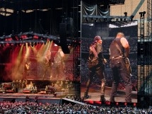 Band performing live on stage at outdoor concert.