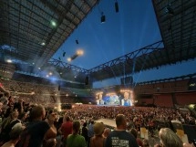 Concert crowd in a large stadium at night
