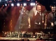 Live concert with band performing on stage.