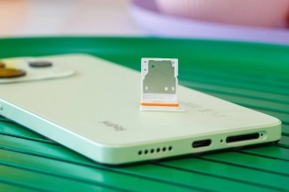 SIM tray on back of 2025 popular smartphone.