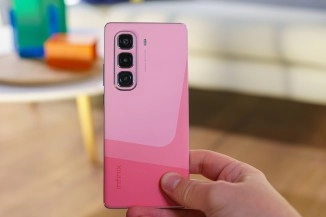 Pink Infinix phone with triple camera, 2025.