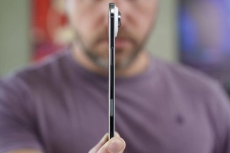 2025 popular phone side profile held by person