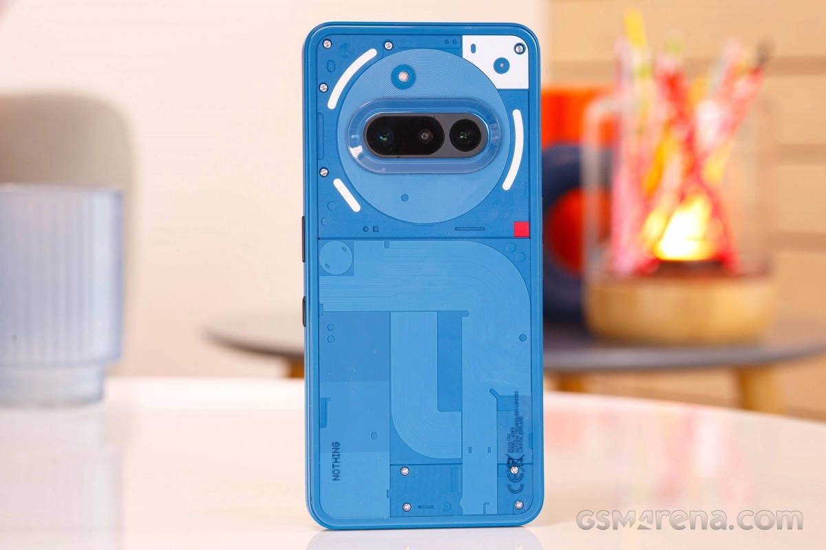Blue Nothing Phone (4a) rear, transparent Glyph design.