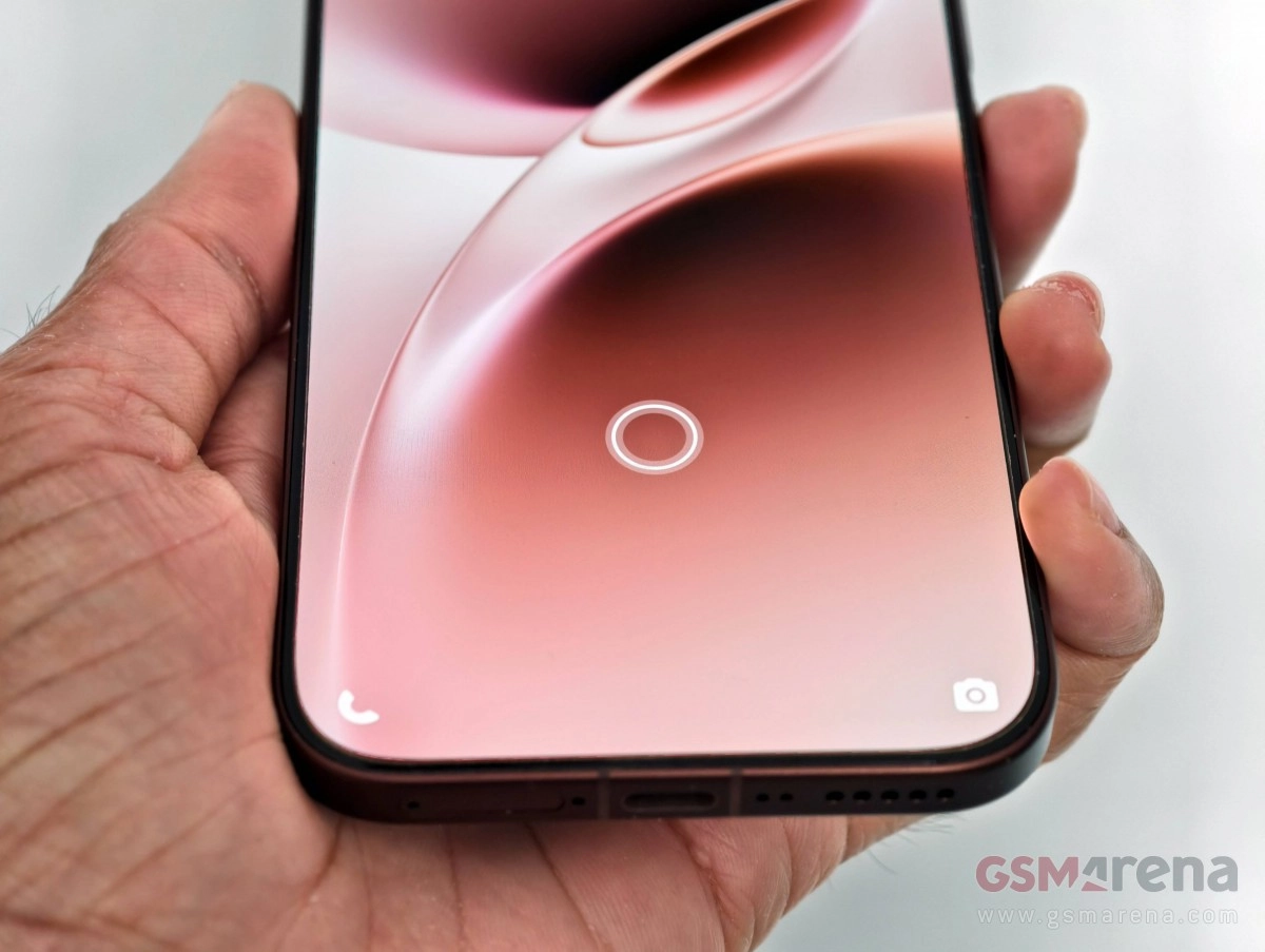 vivo V70 Elite held in hand, screen and port.